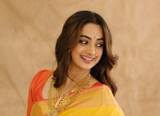 Namitha Pramod namitha pramod in bright sunny yellow silk saree with contrasting solid coral orange silk blouse with plain short sleeves and a scoop neck