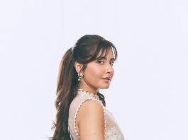 raashi khanna in lightweight sheer white fabric saree with matching sleeveless blouse with a sheer mesh illusion neckline photos
