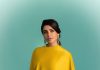 Samantha Ruth Prabhu samantha ruth prabhu wearing a mustard yellow chartreuse ensemble featuring a high neckline and a draped cape like overlay that flows over her shoulders and down the right side of the dress