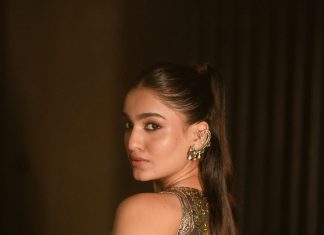 Saniya Iyappan saniya iyappan in high waisted floor length skirt with sleeveless halter style crop top in shimmering metallic gold brocade fabric