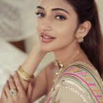 sreeleela in Ivory colour saree with multicolour border and tube style matching embroidered blouse pics