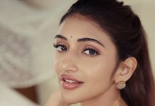 sreeleela in Ivory colour saree with multicolour border and tube style matching embroidered blouse pics