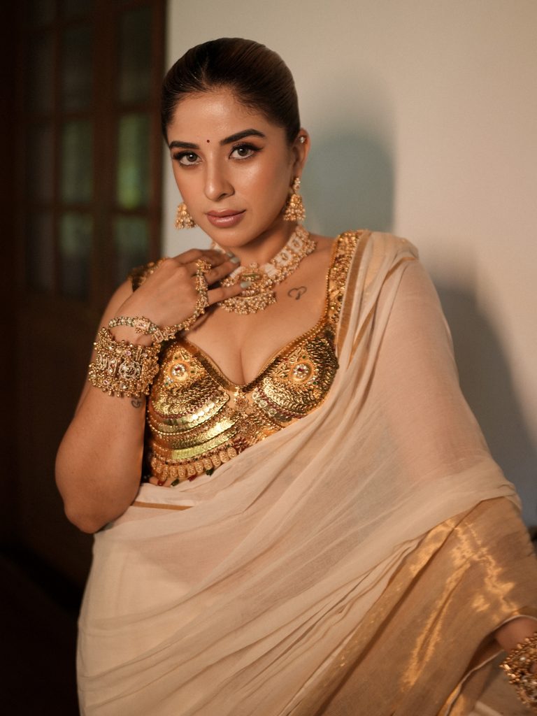 Close up Kasavu saree jewelry pose traditional jhumka