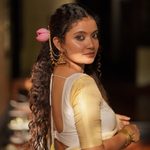 Side profile candid glance in traditional Kerala saree