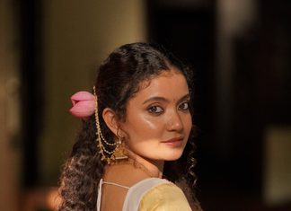 Side profile candid glance in traditional Kerala saree