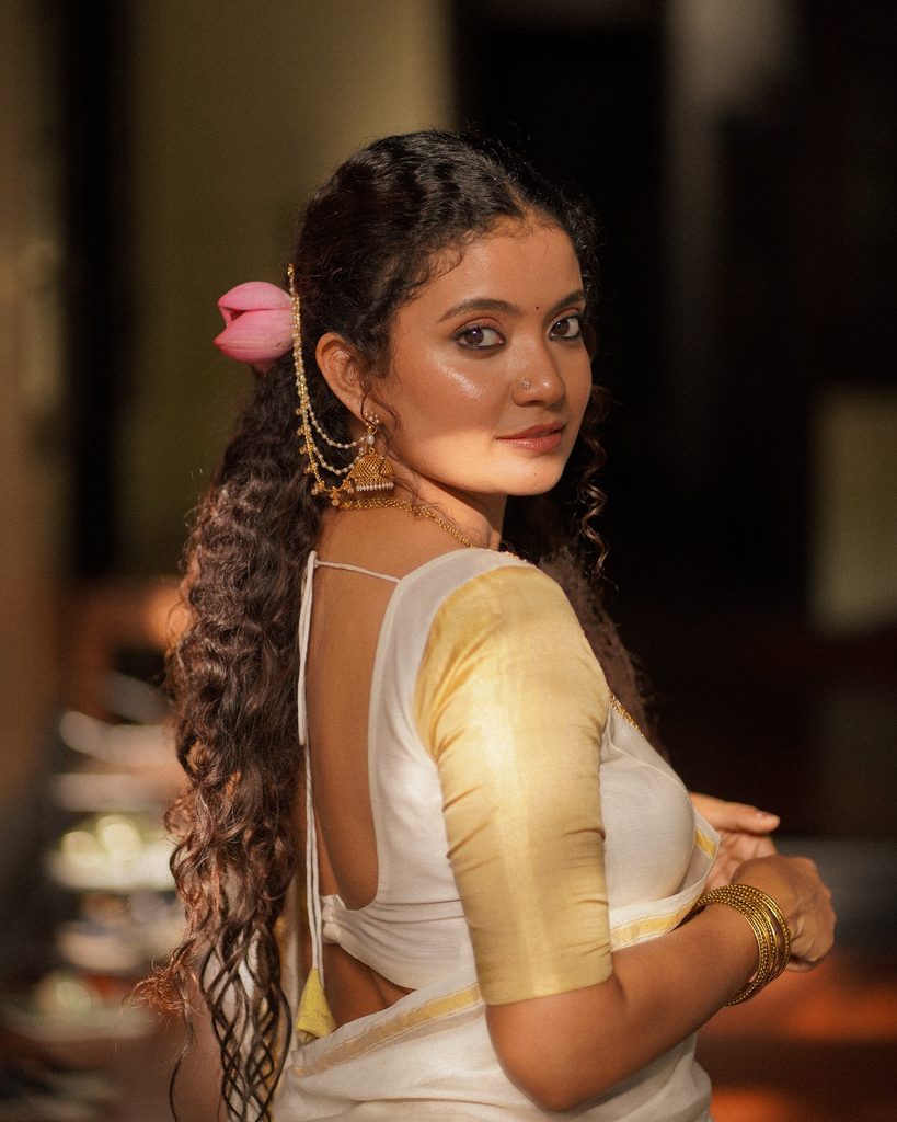 Side profile candid glance in traditional Kerala saree