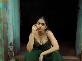anarkali marikar in Indo western fusion ensemble consisting of a structured olive green corset top with thin straps and cupped satin detailing at the bust paired with dark green flared skirt