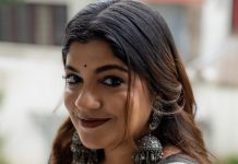 aparna balamurali in classic off white traditional saree embellished with delicate red polka dot motifs and a contrasting black border photos