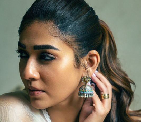 Nayantara nayanthara in full white sleeveless churidar with matching jimikki styling ideas photos