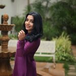 rajisha vijayan in deep purple long Anarkali kurta featuring a high round neck full length fitted sleeves dress photos