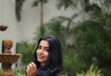 rajisha vijayan in deep purple long Anarkali kurta featuring a high round neck full length fitted sleeves dress photos