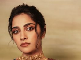 rukmini vasanth in Deep Wine Draped Indo Western Gown Styled with a chunky traditional gold choker set with blue accents photos