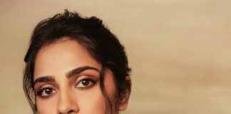 rukmini vasanth in Deep Wine Draped Indo Western Gown Styled with a chunky traditional gold choker set with blue accents photos