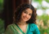 anupama parameswaran in teal blue green long fitted top blouse V neckline and elbow length sleeves with patterned cuffs Lehenga Set photos
