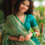 anupama parameswaran in teal blue green long fitted top blouse V neckline and elbow length sleeves with patterned cuffs Lehenga Set photos