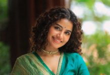 anupama parameswaran in teal blue green long fitted top blouse V neckline and elbow length sleeves with patterned cuffs Lehenga Set photos