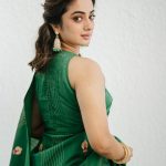 namitha pramod in rich emerald green fabric with a subtle sheen characteristic of fine silk saree Paired with a matching sleeveless round neck blouse photos