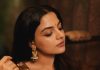 nikhila vimal in lightweight chocolate brown saree with sleeveless blouse
