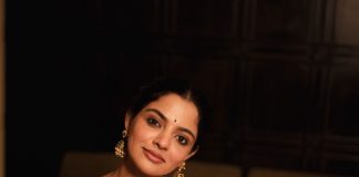 nikhila vimal in rich maroon red saree with Dark emerald green or forest green blouse styling photos