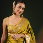 priya varrier in mustard yellow hue with a glossy silk saree heavily embellished sleeveless corset or bustier style blouse ideas photos