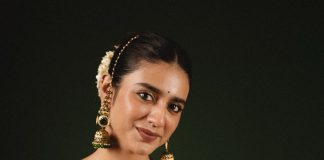 Priya Warrier priya varrier in mustard yellow hue with a glossy silk saree heavily embellished sleeveless corset or bustier style blouse ideas photos