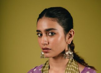 priya varrier in violet long length top with palazzo pants outfit photos