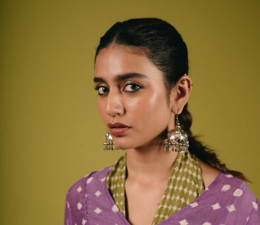 Priya Warrier priya varrier in violet long length top with palazzo pants outfit photos