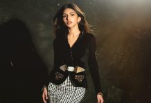 sreeleela in luxurious black velvet jacket featuring a sharp V neckline Cinctured at the waist with a statement geometric belt photos