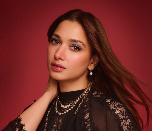 Tamanna Bhatia tamanna in floor length black gown featuring a high mock neckline and an intricate sheer lace bodice panel design outfit