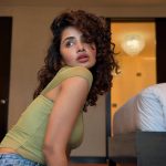 anupama parameswaran in Olive green sleeveless fitted crop top with Light wash denim jeans Features standard belt loops silver button or rivet hardware style photos