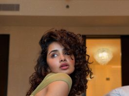 Anupama Parameshwaran anupama parameswaran in Olive green sleeveless fitted crop top with Light wash denim jeans Features standard belt loops silver button or rivet hardware style photos