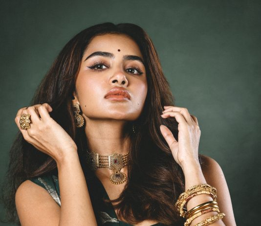 anupama parameswaran in bottle green strapless corset top with structured vertical boning channels and fitted body con pre draped skirt with center front knotting design photos