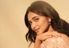 kayadu lohar in pale pink traditional ethnic saree ensemble with a matching sleeveless blouse and classic golden toned pearl statement necklace photos