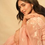 kayadu lohar in pale pink traditional ethnic saree ensemble with a matching sleeveless blouse and classic golden toned pearl statement necklace photos