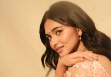 kayadu lohar in pale pink traditional ethnic saree ensemble with a matching sleeveless blouse and classic golden toned pearl statement necklace photos