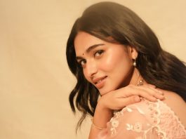 Kayadu Lohar kayadu lohar in pale pink traditional ethnic saree ensemble with a matching sleeveless blouse and classic golden toned pearl statement necklace photos